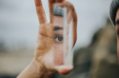 shallow focus of person holding mirror